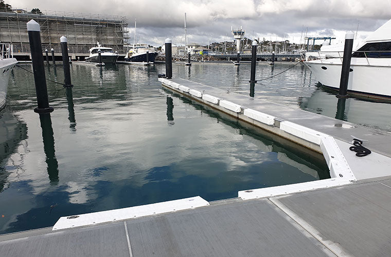 Marina berth set up with marina fenders and dock lines / mooring lines / ropes from Hauraki Fenders